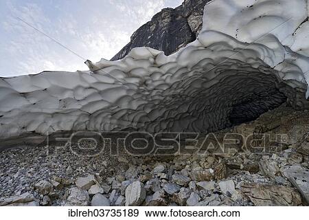 "Tunnel of an old snow field, Gschnitztal valley, Tyrol, Austria, Europe" View Large Photo Image Stock Photo - "Tunnel of an old snow field, Gschnitztal valley, Tyrol, Austria, Europe". Fotosearch