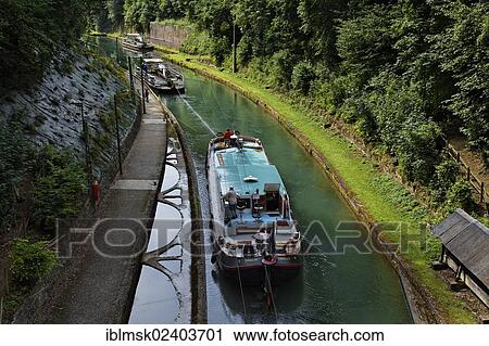 Stock Image - "Tunnel of Riqueval for the Canal of Saint-Quentin, the towboat travels along a chain and can pull multiple ships through the tunnel, Saint-Quentin, department of Aisne, Picardy region, France, Europe". Fotosearch