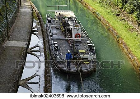 "Tunnel of Riqueval for the Canal of Saint-Quentin, the towboat travels along a chain and can pull multiple ships through the tunnel, Saint-Quentin, department of Aisne, Picardy region, France, Europe" View Large Photo Image Stock Photo - "Tunnel of Riqueval for the Canal of Saint-Quentin, the towboat travels along a chain and can pull multiple ships through the tunnel, Saint-Quentin, department of Aisne, Picardy region, France, Europe". Fotosearch