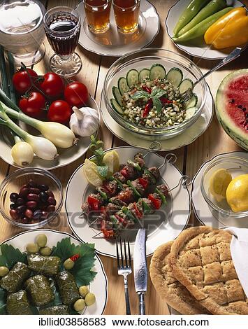 "Turkish national cuisine, vine leaves in olive oil, pita bread, salad, grilled lamb skewers, black tea" View Large Photo Image Stock Image - "Turkish national cuisine, vine leaves in olive oil, pita bread, salad, grilled lamb skewers, black tea". Fotosearch