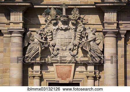 "Two angels holding the coat of arms of Prince-Abbot Adalbert von Schleifras above the main entrance of St. Salvator Cathedral of Fulda, Fulda Cathedral, Fulda, Fulda, Hesse, Germany, Europe" View Large Photo Image Stock Photograph - "Two angels holding the coat of arms of Prince-Abbot Adalbert von Schleifras above the main entrance of St. Salvator Cathedral of Fulda, Fulda Cathedral, Fulda, Fulda, Hesse, Germany, Europe". Fotosearch