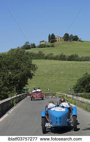 "Two Bugatti convertibles, classic cars, race cars, Mille Miglia car race, near San Quirico d'Orcia, Tuscany, Italy, Europe" View Large Photo Image Stock Photo - "Two Bugatti convertibles, classic cars, race cars, Mille Miglia car race, near San Quirico d'Orcia, Tuscany, Italy, Europe". Fotosearch