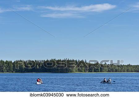 "Two canoes with canoeists on Lake Asnen, Smaland, Sweden, Europe" View Large Photo Image Stock Image - "Two canoes with canoeists on Lake Asnen, Smaland, Sweden, Europe". Fotosearch