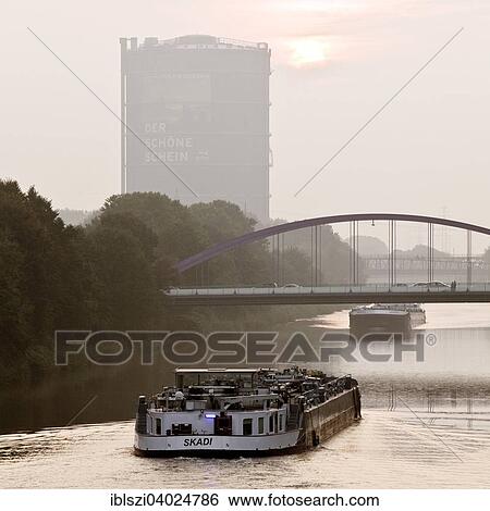 "Two cargo ships on the Rhine-Herne Canal with Gasometer, Oberhausen, Ruhr district, North Rhine-Westphalia, Germany, Europe" View Large Photo Image Stock Photograph - "Two cargo ships on the Rhine-Herne Canal with Gasometer, Oberhausen, Ruhr district, North Rhine-Westphalia, Germany, Europe". Fotosearch