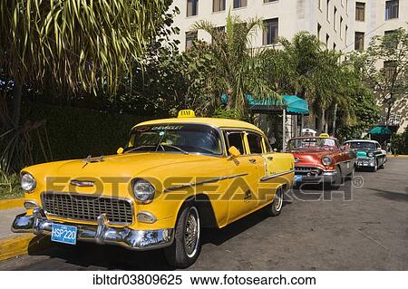 "Two Chevrolets and one Oldmobile, classic cars parked in the streets of Havana, Havana, Cuba, North America" View Large Photo Image Stock Photography - "Two Chevrolets and one Oldmobile, classic cars parked in the streets of Havana, Havana, Cuba, North America". Fotosearch