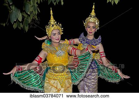 Stock Image - "Two dancers at the Loi Krathong Festival of Lights, Chiang Mai, Thailand, Asia". Fotosearch