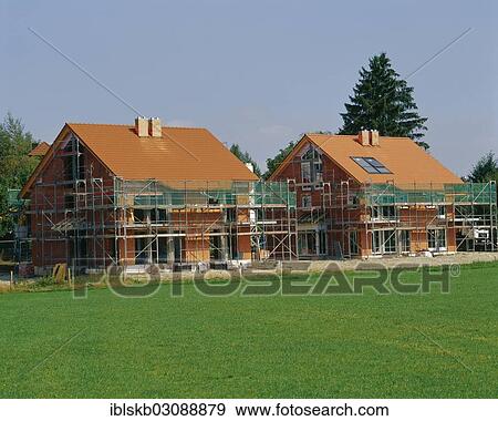 "Two detached houses under construction, Baierbrunn, Bavaria, Germany, Europe" View Large Photo Image Stock Photo - "Two detached houses under construction, Baierbrunn, Bavaria, Germany, Europe". Fotosearch