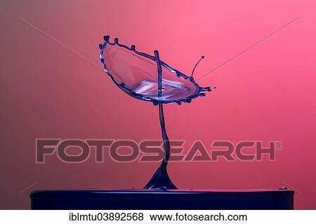 Two drops colliding View Large Photo Image Stock Photo - Two drops colliding. Fotosearch