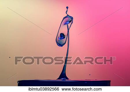 Stock Photograph - Two drops colliding. Fotosearch