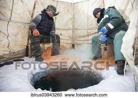 "Two elderly fishermenfishing on the frozen Lake Baikal, Bolschoje Goloustnoje, Lake Baikal Region, Siberia, Russia, Europe" View Large Photo Image Stock Image - "Two elderly fishermenfishing on the frozen Lake Baikal, Bolschoje Goloustnoje, Lake Baikal Region, Siberia, Russia, Europe". Fotosearch