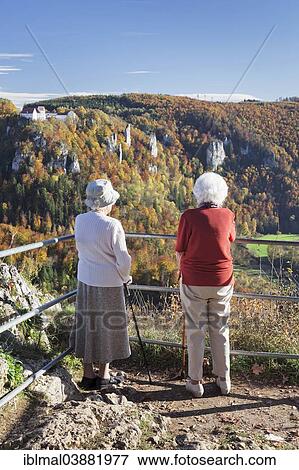 "Two elderly ladies looking at the view over Danube Gorge from Burg Wildenstein Castle, Upper Danube Nature Park, Swabian Jura, Baden-Wurttemberg, Germany, Europe" View Large Photo Image Stock Photo - "Two elderly ladies looking at the view over Danube Gorge from Burg Wildenstein Castle, Upper Danube Nature Park, Swabian Jura, Baden-Wurttemberg, Germany, Europe". Fotosearch