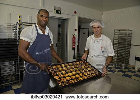 "Two employees of the Confeitaria dos Pasteis de Belem pastry shop with the famous pasteis cream tarts, Belem, Lisbon, Lisbon District, Portugal, Europe" View Large Photo Image Stock Image - "Two employees of the Confeitaria dos Pasteis de Belem pastry shop with the famous pasteis cream tarts, Belem, Lisbon, Lisbon District, Portugal, Europe". Fotosearch