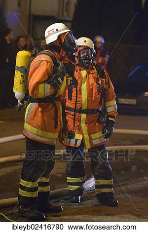 Two firefighters on site at an apartment fire, Stuttgart, Baden-Wuerttemberg, Germany, Europe View Large Photo Image Stock Image - Two firefighters on site at an apartment fire, Stuttgart, Baden-Wuerttemberg, Germany, Europe. Fotosearch