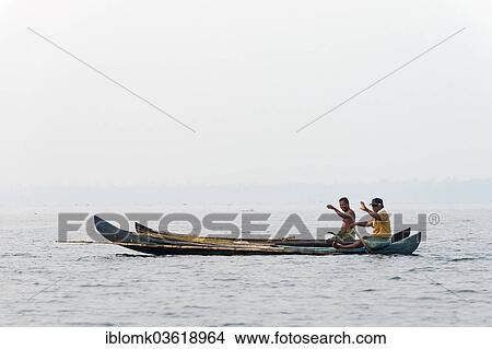 "Two fishermen in their boats, waving, Vembanad lake, Kerala, India, Asia" View Large Photo Image Picture - "Two fishermen in their boats, waving, Vembanad lake, Kerala, India, Asia". Fotosearch