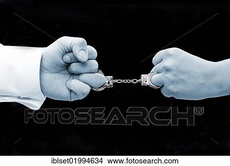 "Two fists joined by miniature handcuffs, symbilic image for marriage" View Large Photo Image Picture - "Two fists joined by miniature handcuffs, symbilic image for marriage". Fotosearch