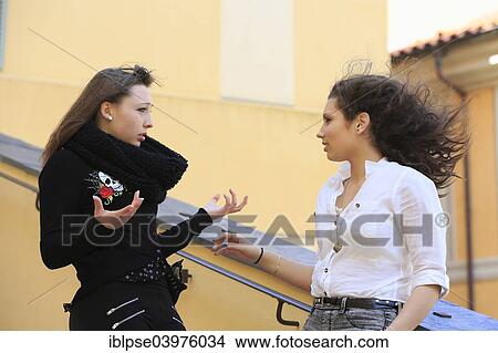 Picture - "Two girlfriends, teenagers, arguing, Menton, Alpes-Maritimes, Provence-Alpes-Cote d'Azur, France, Europe". Fotosearch