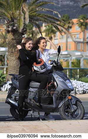 "Two girlfriends, teenagers, with a scooter, Menton, Alpes-Maritimes, Provence-Alpes-Cote d'Azur, France, Europe" View Large Photo Image Picture - "Two girlfriends, teenagers, with a scooter, Menton, Alpes-Maritimes, Provence-Alpes-Cote d'Azur, France, Europe". Fotosearch