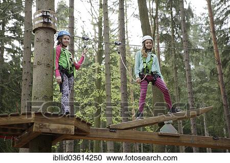 "Two girls, 12, climbing in a climbing park, Svaty Linhart, Karlovy Vary, Karlovy Vary Region, Bohemia, Czech Republic, Europe" View Large Photo Image Stock Image - "Two girls, 12, climbing in a climbing park, Svaty Linhart, Karlovy Vary, Karlovy Vary Region, Bohemia, Czech Republic, Europe". Fotosearch
