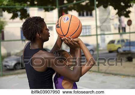"Two girls, 15 and 10, training basketball, Rio de Janeiro, Rio de Janeiro State, Brazil, South America" View Large Photo Image Stock Image - "Two girls, 15 and 10, training basketball, Rio de Janeiro, Rio de Janeiro State, Brazil, South America". Fotosearch