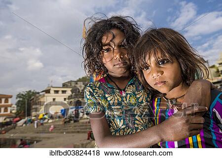 Stock Photo - "Two girls at the banks of the holy river Godwari, Nasik, Maharashtra, India, Asia". Fotosearch