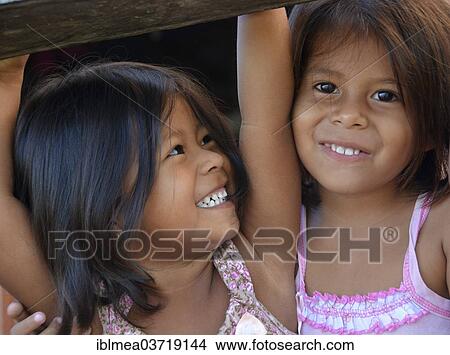 Picture - "Two girls in an Indian village, Mamiraua-Nationalpark, near Tefe, Amazonas State, Brazil, South America". Fotosearch