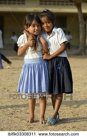 "Two girls on the playground, Lompong Village, Bathi District, Takeo Province, Cambodia, Asia" View Large Photo Image Stock Image - "Two girls on the playground, Lompong Village, Bathi District, Takeo Province, Cambodia, Asia". Fotosearch