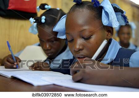 "Two girls writing in a notebook, school for earthquake refugees, Fort National, Port-au-Prince, Haiti, North America" View Large Photo Image Stock Image - "Two girls writing in a notebook, school for earthquake refugees, Fort National, Port-au-Prince, Haiti, North America". Fotosearch
