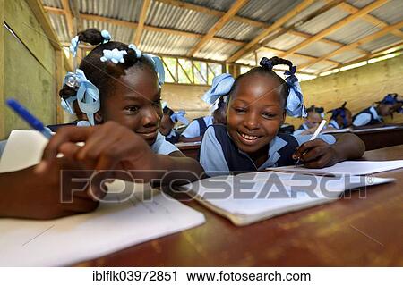 "Two girls writing in a notebook, school for earthquake refugees, Fort National, Port-au-Prince, Haiti, North America" View Large Photo Image Stock Image - "Two girls writing in a notebook, school for earthquake refugees, Fort National, Port-au-Prince, Haiti, North America". Fotosearch