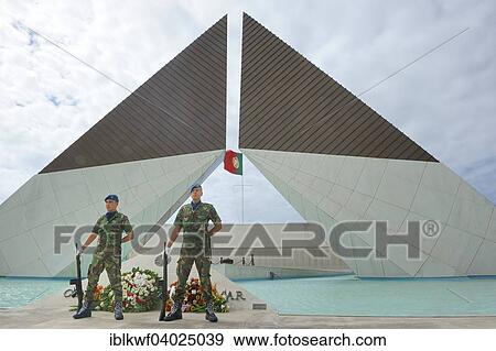 "Two guards standing in front of the Colonial War Memoril, with wreaths, everlasting fire, Colonial War Memorial, names of fallen soldiers from the colonial wars on the wall at the back, Belem, Lisbon, Portugal, Europe" View Large Photo Image Stock Photo - "Two guards standing in front of the Colonial War Memoril, with wreaths, everlasting fire, Colonial War Memorial, names of fallen soldiers from the colonial wars on the wall at the back, Belem, Lisbon, Portugal, Europe". Fotosearch