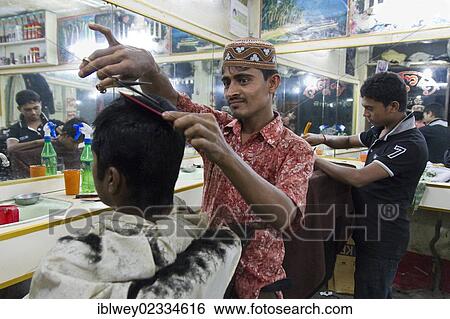 "Two hairdressers cut their customer's hair, New Market, Dhaka, Bangladesh, South Asia, Asia" View Large Photo Image Stock Photograph - "Two hairdressers cut their customer's hair, New Market, Dhaka, Bangladesh, South Asia, Asia". Fotosearch
