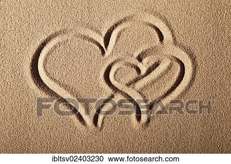 Two hearts drawn in sand View Large Photo Image Stock Image - Two hearts drawn in sand. Fotosearch