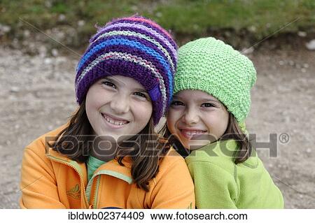 "Two hiking girls wearing wool caps, province of Bolzano-Bozen, Alto Adige, Italy, Europe" View Large Photo Image Stock Photo - "Two hiking girls wearing wool caps, province of Bolzano-Bozen, Alto Adige, Italy, Europe". Fotosearch