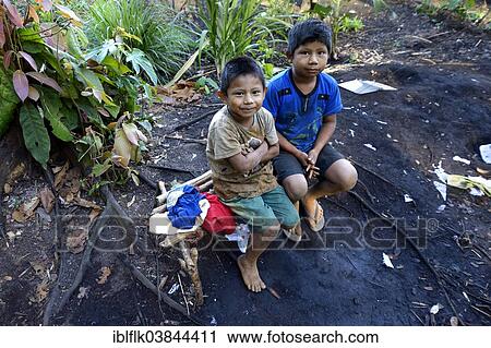 "Two indigenous boys in the village of the Xavantes people, Tres Rios near the mission of Sangradouro, Primavera do Leste, Mato Grosso, Brazil, South America" View Large Photo Image Stock Image - "Two indigenous boys in the village of the Xavantes people, Tres Rios near the mission of Sangradouro, Primavera do Leste, Mato Grosso, Brazil, South America". Fotosearch