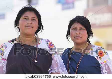 Stock Photograph - "Two indigenous young women, 15 and 17 years, indigenas in traditional costume, Otavalo, Imbabura Province, Ecuador, South America". Fotosearch