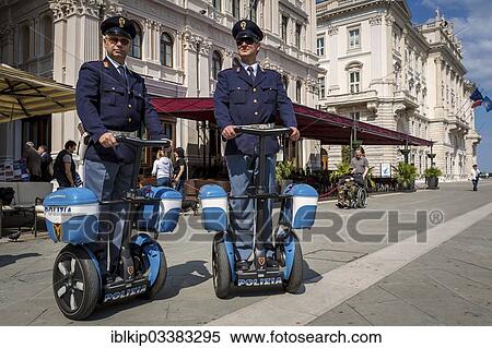 "Two Italian police officers on Segways, on Piazza Unita d'Italia, Trieste, Province of Trieste, Friuli-Venezia Giulia, Italy, Europe" View Large Photo Image Stock Photography - "Two Italian police officers on Segways, on Piazza Unita d'Italia, Trieste, Province of Trieste, Friuli-Venezia Giulia, Italy, Europe". Fotosearch