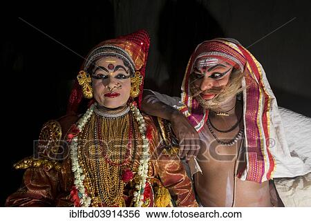 Stock Photograph - "Two Katakali artists with the complete make up of the characters Sathi, left, and Old Brahmin, right, for the Dhecheyagam play, Varkala, Kerala, India, Asia". Fotosearch