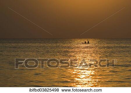 "Two kayakers in the open sea at sunset, Palolem Beach, Canacona, Goa, India, Asia" View Large Photo Image Stock Photo - "Two kayakers in the open sea at sunset, Palolem Beach, Canacona, Goa, India, Asia". Fotosearch