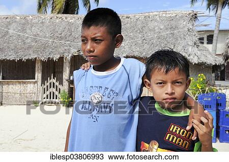 "Two Kuna Indian boys, in a Kuna Indian village, Nalunega, San Blas Islands, Panama, North America" View Large Photo Image Stock Image - "Two Kuna Indian boys, in a Kuna Indian village, Nalunega, San Blas Islands, Panama, North America". Fotosearch