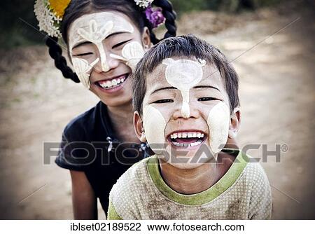 "Two laughing children with thanaka paste on their faces, Bagan, Myanmar, Burma, Southeast Asia, Asia" View Large Photo Image Stock Image - "Two laughing children with thanaka paste on their faces, Bagan, Myanmar, Burma, Southeast Asia, Asia". Fotosearch