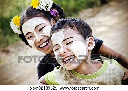 "Two laughing children with thanaka paste on their faces, Bagan, Myanmar, Burma, Southeast Asia, Asia" View Large Photo Image Stock Photography - "Two laughing children with thanaka paste on their faces, Bagan, Myanmar, Burma, Southeast Asia, Asia". Fotosearch