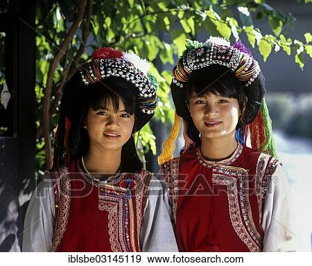 "Two Lisu girls wearing colourful headdresses and the traditional costume of the mountain people, Mae Sai, Chiang Rai Province, Northern Thailand, Thailand, Asia" View Large Photo Image Stock Photo - "Two Lisu girls wearing colourful headdresses and the traditional costume of the mountain people, Mae Sai, Chiang Rai Province, Northern Thailand, Thailand, Asia". Fotosearch