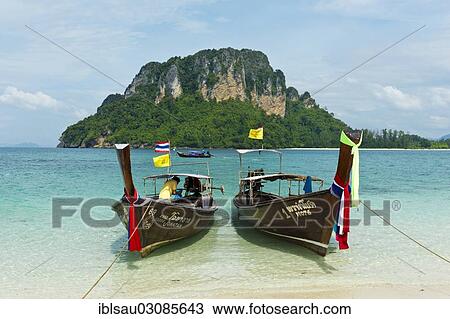 "Two longtail boats on a beach, Insel Tup, Ao Nang, Krabi Province, Southern Thailand, Thailand, Asia" View Large Photo Image Stock Image - "Two longtail boats on a beach, Insel Tup, Ao Nang, Krabi Province, Southern Thailand, Thailand, Asia". Fotosearch