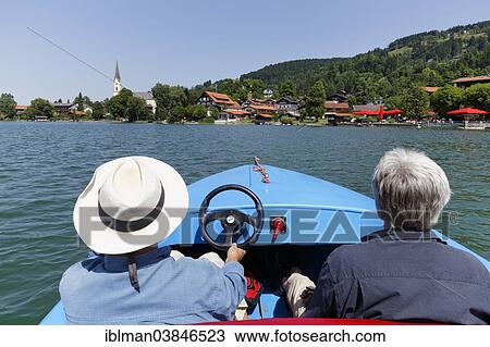 "Two men on an electric boat on Lake Schliersee, Schliersee, Upper Bavaria, Bavaria, Germany, Europe" View Large Photo Image Stock Image - "Two men on an electric boat on Lake Schliersee, Schliersee, Upper Bavaria, Bavaria, Germany, Europe". Fotosearch