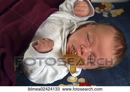 Two-month-old baby sleeping with pacifier View Large Photo Image Stock Image - Two-month-old baby sleeping with pacifier. Fotosearch