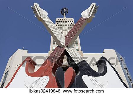 Stock Photograph - Two monumental, crossed guitars, sign for a nightclub located on Sheikh Zayed Road, Dubai, United Arab Emirates, Middle East, Asia. Fotosearch