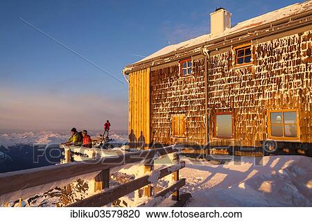 "Two mountaineers watching the sunrise at the Archduke Johann cabin on Mt Grossglockner, Glockner Group, near Heiligenblut, Carinthia, Austria, Europe" View Large Photo Image Stock Image - "Two mountaineers watching the sunrise at the Archduke Johann cabin on Mt Grossglockner, Glockner Group, near Heiligenblut, Carinthia, Austria, Europe". Fotosearch