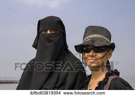 "Two Muslim women, one dressed in the traditional black chador, the other one in western style clothes, Mumbai, Maharashtra, India, Asia" View Large Photo Image Picture - "Two Muslim women, one dressed in the traditional black chador, the other one in western style clothes, Mumbai, Maharashtra, India, Asia". Fotosearch