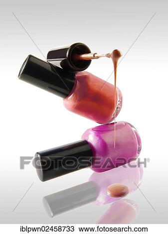 Two nail varnish bottles balanced on each other View Large Photo Image Stock Image - Two nail varnish bottles balanced on each other. Fotosearch