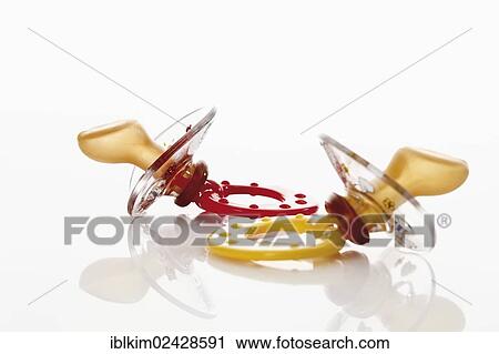 Two pacifiers View Large Photo Image Stock Image - Two pacifiers. Fotosearch