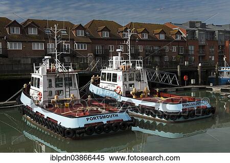 "Two Portsmouth tug boats moored in Portsmouth Harbour, Old Portsmouth, Portsmouth, Hampshire, England, United Kingdom, Europe" View Large Photo Image Stock Photography - "Two Portsmouth tug boats moored in Portsmouth Harbour, Old Portsmouth, Portsmouth, Hampshire, England, United Kingdom, Europe". Fotosearch
